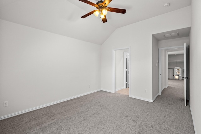 unfurnished bedroom with lofted ceiling, light colored carpet, visible vents, ceiling fan, and baseboards