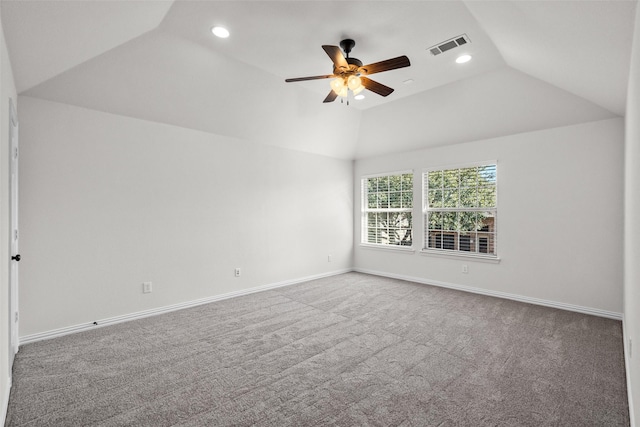 spare room featuring recessed lighting, visible vents, vaulted ceiling, and baseboards