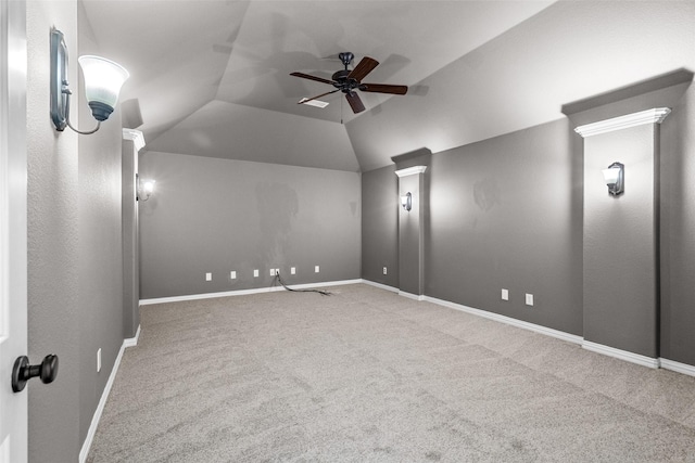 carpeted cinema room with lofted ceiling, ceiling fan, and baseboards