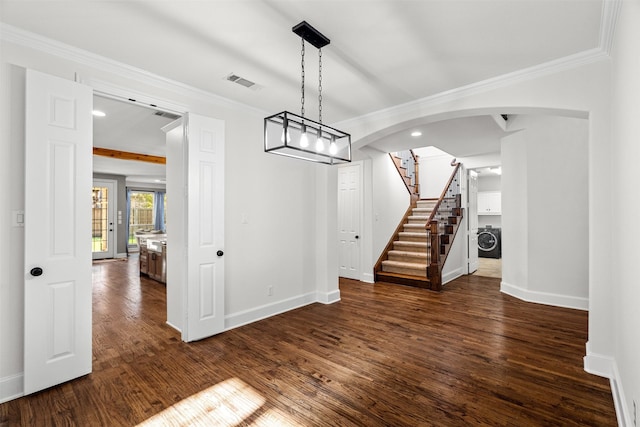 unfurnished dining area with arched walkways, visible vents, stairs, dark wood finished floors, and crown molding