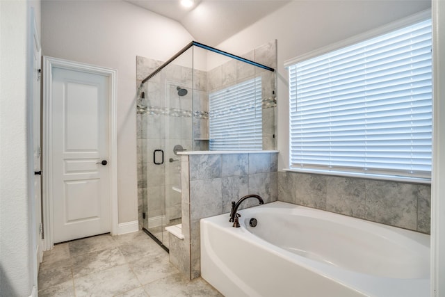 full bathroom with a garden tub and a shower stall