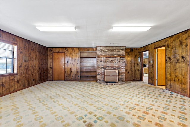 interior space with wooden walls and light colored carpet