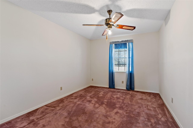 spare room with ceiling fan, a textured ceiling, baseboards, and carpet flooring