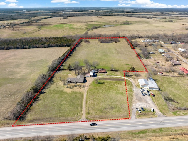 birds eye view of property featuring a rural view