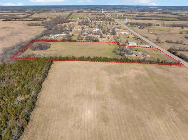 birds eye view of property with a rural view