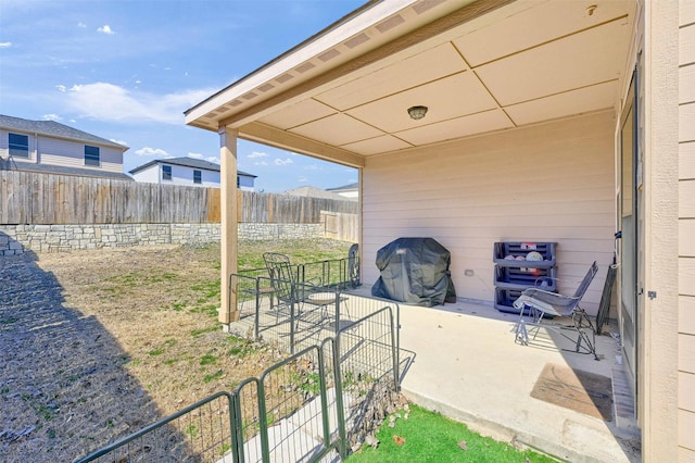 view of patio / terrace featuring fence