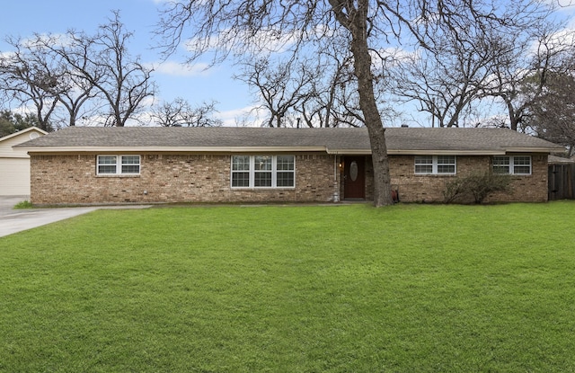 single story home with a front yard and brick siding