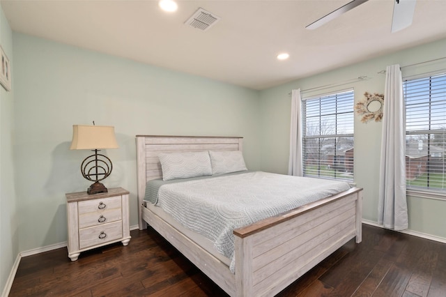 bedroom featuring dark wood-style flooring, visible vents, and baseboards