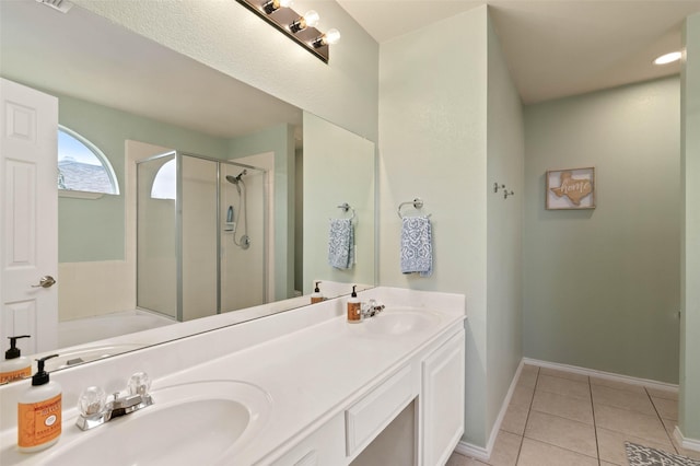 full bathroom with a stall shower, a sink, a bath, and tile patterned floors