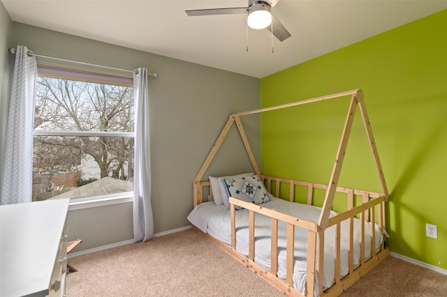 bedroom featuring a ceiling fan, carpet flooring, and baseboards