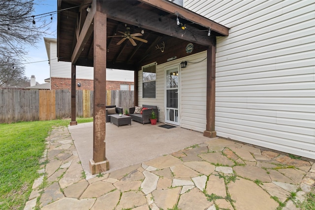 view of patio featuring fence, an outdoor hangout area, and ceiling fan