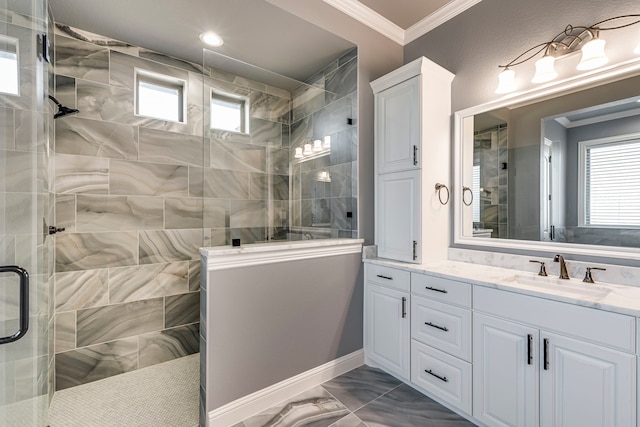 bathroom with marble finish floor, tiled shower, vanity, and crown molding