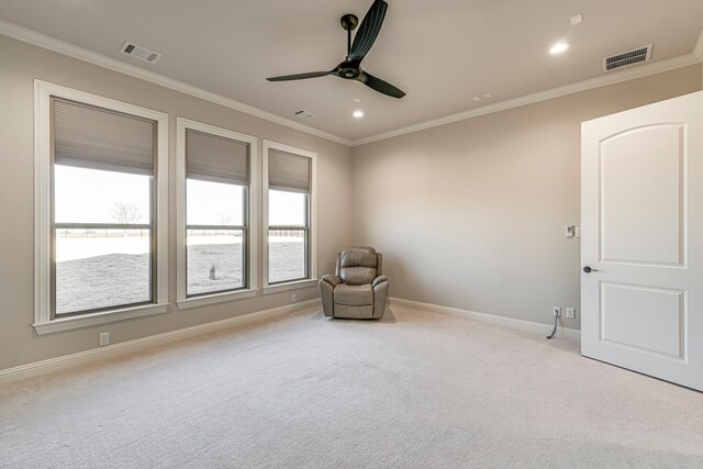 unfurnished room featuring ornamental molding and visible vents