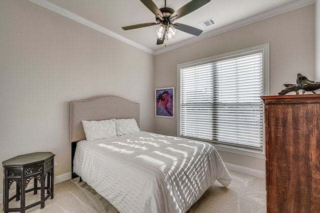 bedroom with visible vents, ornamental molding, light carpet, ceiling fan, and baseboards