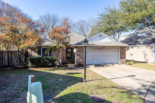 ranch-style home with an attached garage, concrete driveway, a front yard, and fence