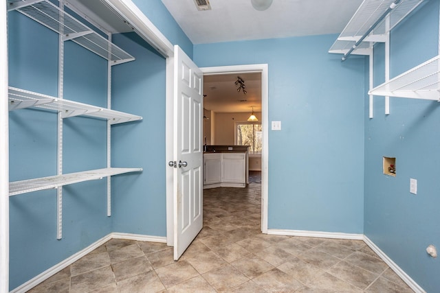 walk in closet featuring visible vents