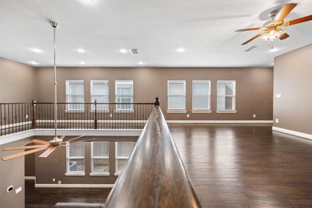 interior space with ceiling fan, recessed lighting, dark wood-style flooring, visible vents, and baseboards