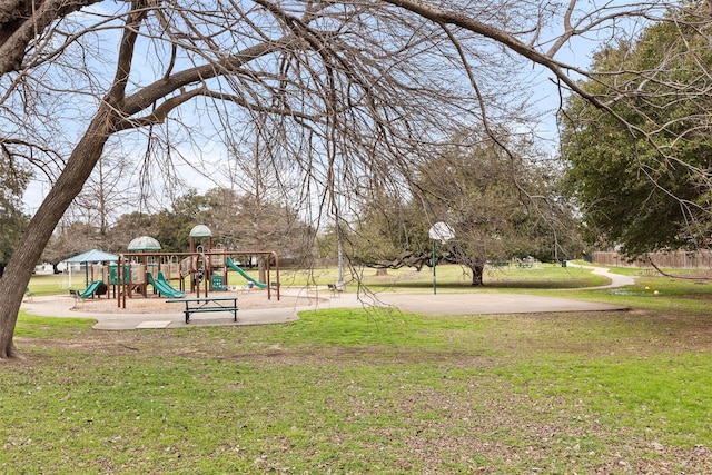 exterior space featuring playground community and a yard