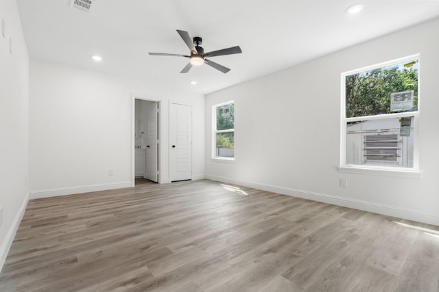 unfurnished room featuring baseboards, recessed lighting, and light wood-style floors