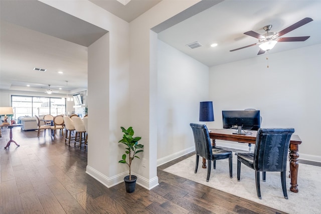 office space featuring recessed lighting, visible vents, a ceiling fan, wood finished floors, and baseboards