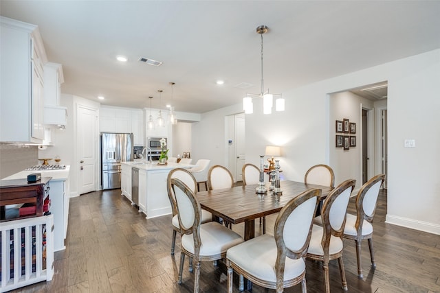 dining space featuring dark wood-style floors, baseboards, visible vents, and recessed lighting