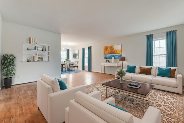living room featuring baseboards and wood finished floors