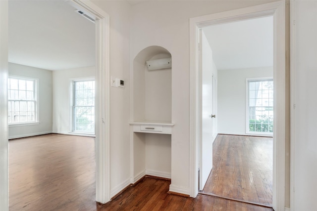 bathroom with vanity, tile walls, toilet, and a healthy amount of sunlight