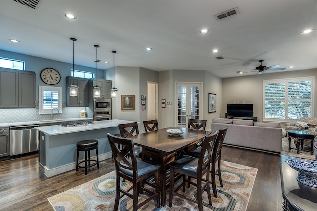 2111 Albany St, Dallas, TX 75201 - dining area featuring dark wood-style flooring, visible vents, french doors, and plenty of natural light