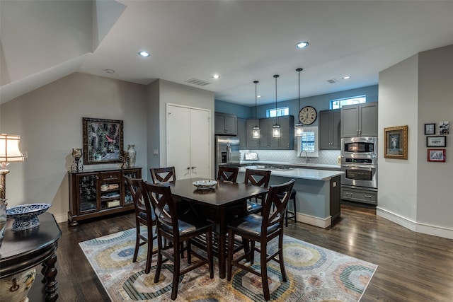2111 Albany St, Dallas, TX 75201 - kitchen with tasteful backsplash, stainless steel appliances, a kitchen island, a sink, and visible vents