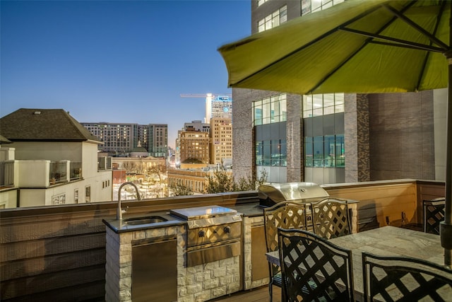 2111 Albany St, Dallas, TX 75201 - balcony with outdoor dining area, a sink, exterior kitchen, area for grilling, and a view of city