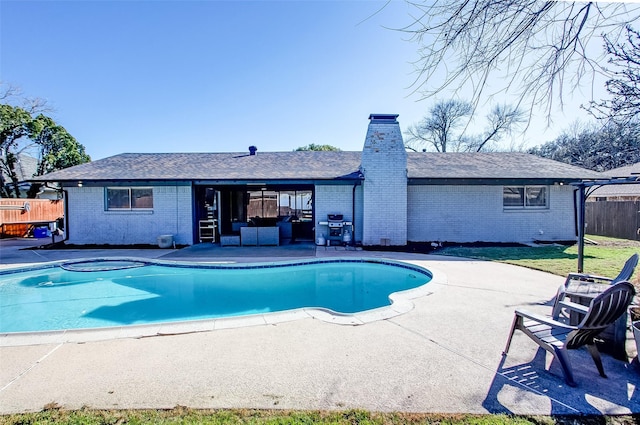 view of pool with a fenced in pool, a patio area, fence, and a hot tub