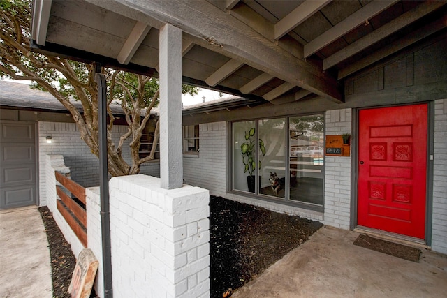 entrance to property with brick siding