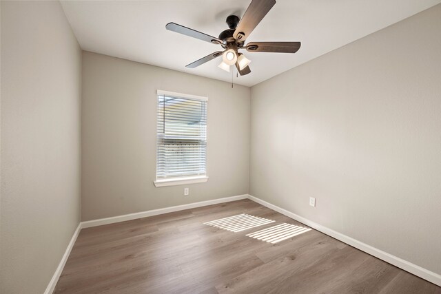 3721 Stuart Dr, Fort Worth, TX 76110 - unfurnished room featuring ceiling fan, baseboards, and wood finished floors