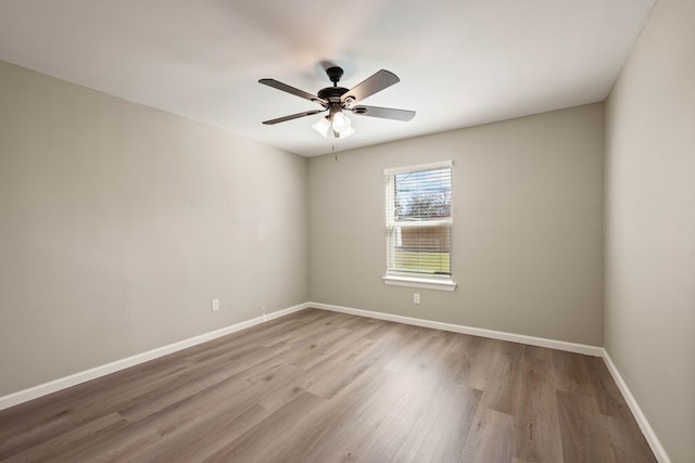 3721 Stuart Dr, Fort Worth, TX 76110 - empty room featuring a ceiling fan, baseboards, and wood finished floors