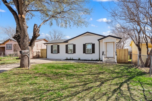 3721 Stuart Dr, Fort Worth, TX 76110 - view of front of home featuring a front lawn and fence