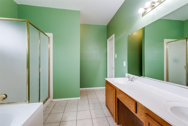 full bath with a sink, a shower stall, a bath, tile patterned floors, and double vanity