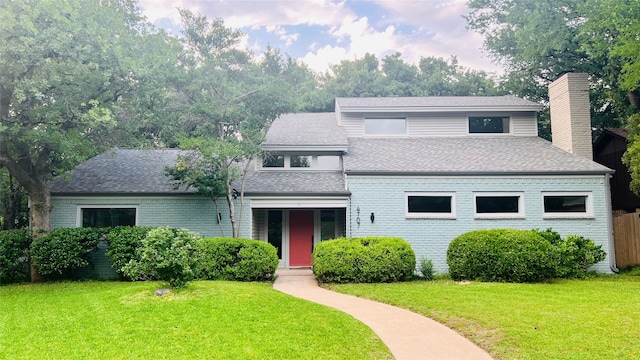 4707 Weyhill Dr, Arlington, TX 76013 - view of front of house featuring roof with shingles, a chimney, and brick siding