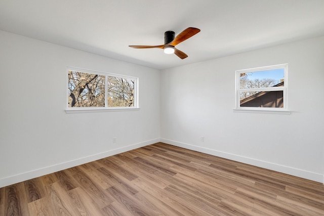 4707 Weyhill Dr, Arlington, TX 76013 - empty room with healthy amount of natural light, baseboards, light wood finished floors, and ceiling fan
