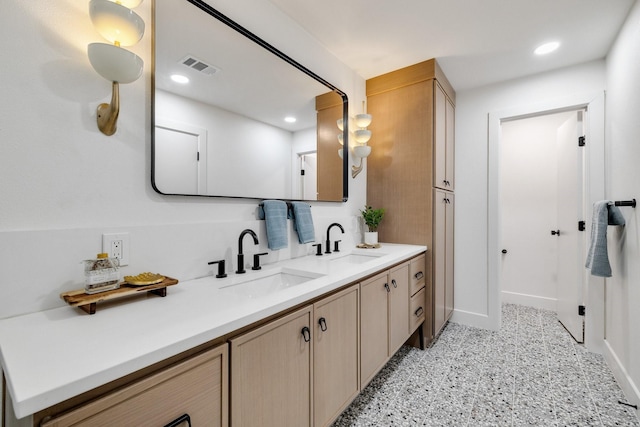 4707 Weyhill Dr, Arlington, TX 76013 - bathroom featuring baseboards, double vanity, recessed lighting, and speckle patterned floor