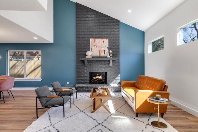 4707 Weyhill Dr, Arlington, TX 76013 - living area featuring high vaulted ceiling, wood finished floors, a brick fireplace, baseboards, and recessed lighting