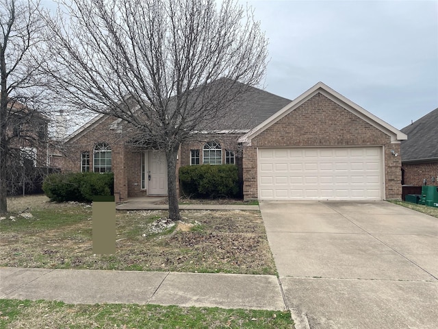 ranch-style house with a garage, driveway, and brick siding