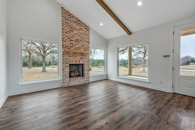 unfurnished living room featuring a fireplace, baseboards, dark wood-style flooring, and beamed ceiling