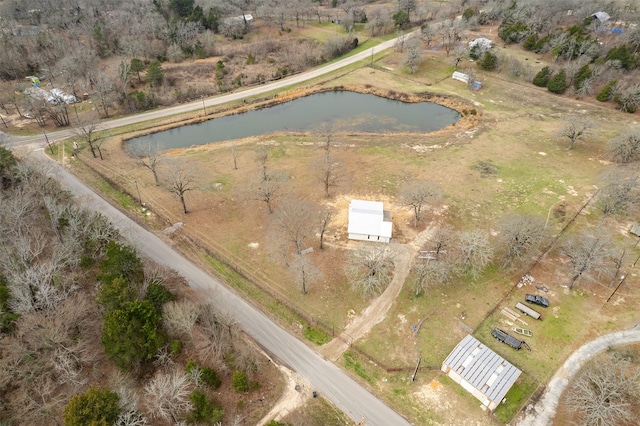 bird's eye view with a water view and a rural view