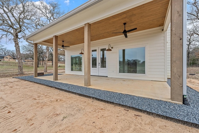 exterior space with a ceiling fan and french doors