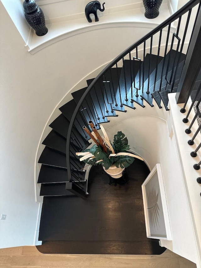 stairs with wood finished floors