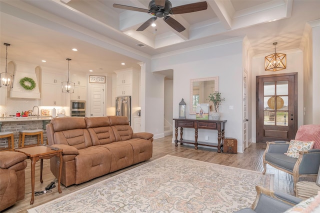 living room with crown molding, coffered ceiling, beamed ceiling, and light wood-style flooring