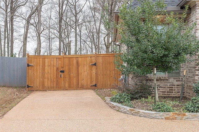 view of gate with fence