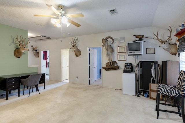 misc room with light colored carpet, visible vents, ceiling fan, and lofted ceiling