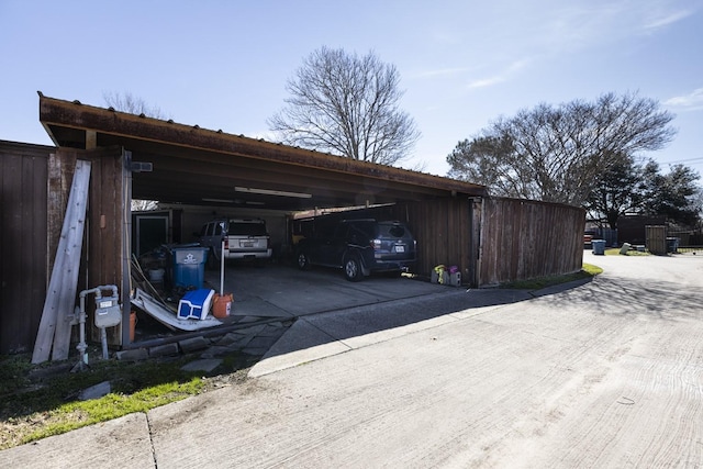 view of vehicle parking featuring a carport