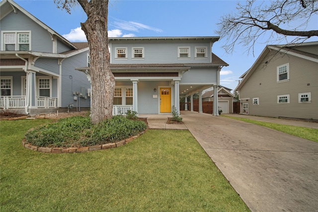 view of front of property with covered porch, driveway, and a front yard